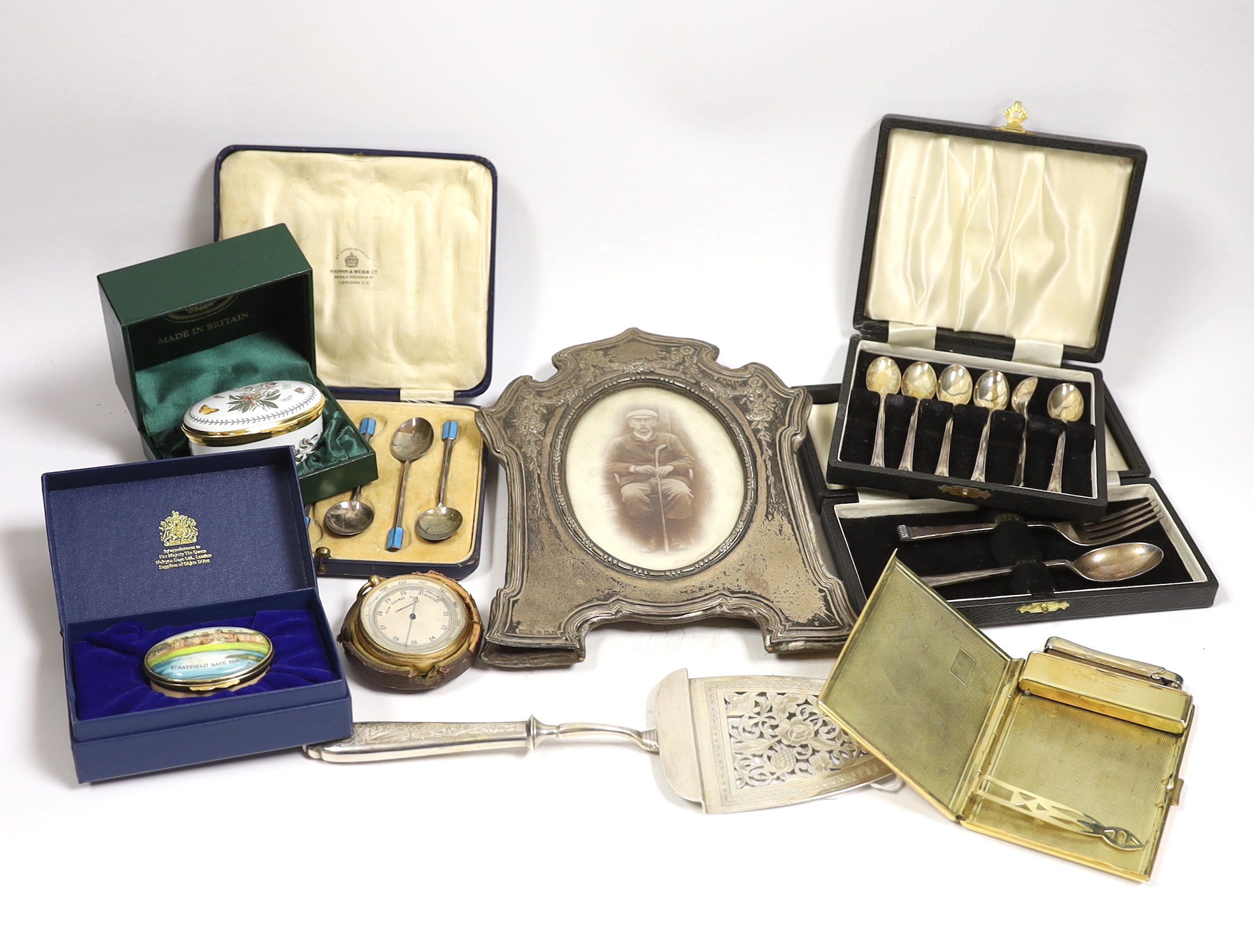 Miscellaneous items including three cased sets of silver flatware including enamelled teaspoons, Halcyon Days boxes, cased barometer, gilt metal case, silver mounted photograph frame, etc.